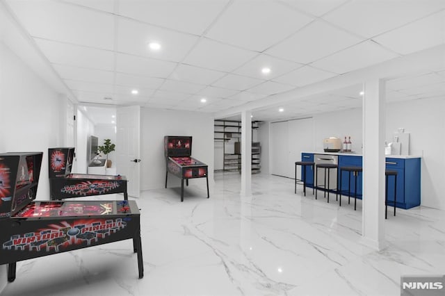 living room featuring marble finish floor, stairway, a drop ceiling, and recessed lighting