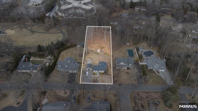 birds eye view of property with a residential view