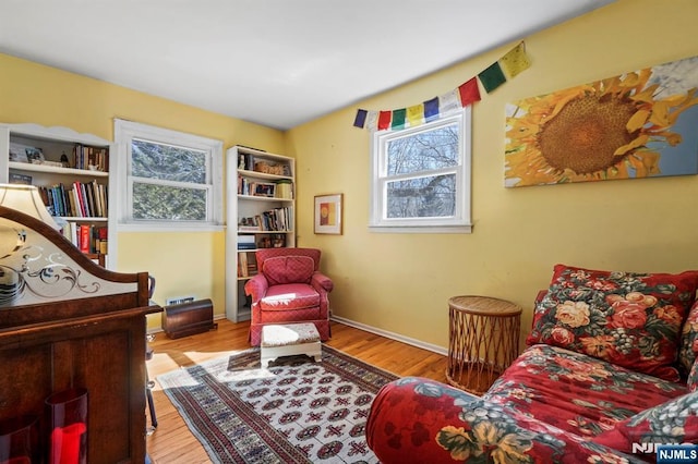 bedroom with wood finished floors and baseboards