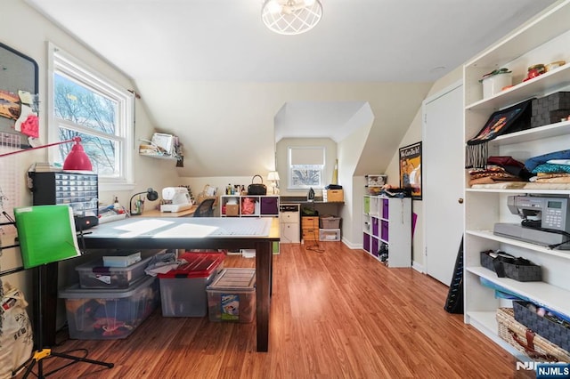 office space with vaulted ceiling, wood finished floors, and baseboards