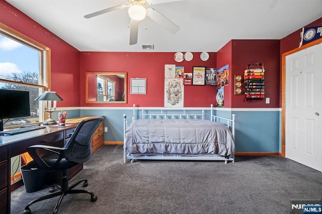 bedroom with a ceiling fan, baseboards, visible vents, and carpet flooring