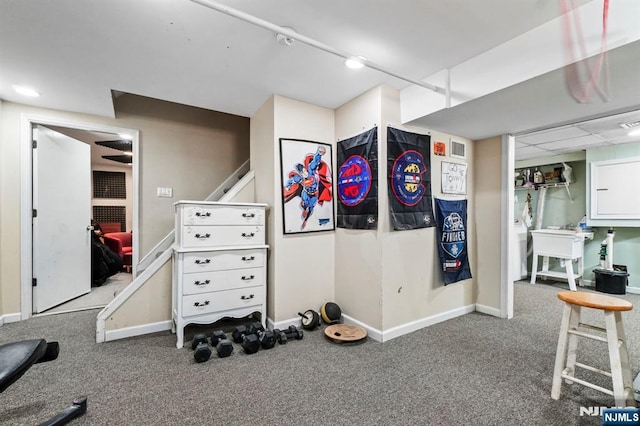 exercise area with carpet flooring and baseboards