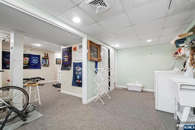 interior space featuring carpet floors, baseboards, visible vents, and washer and clothes dryer