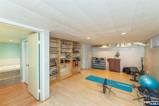 exercise area featuring wood finished floors