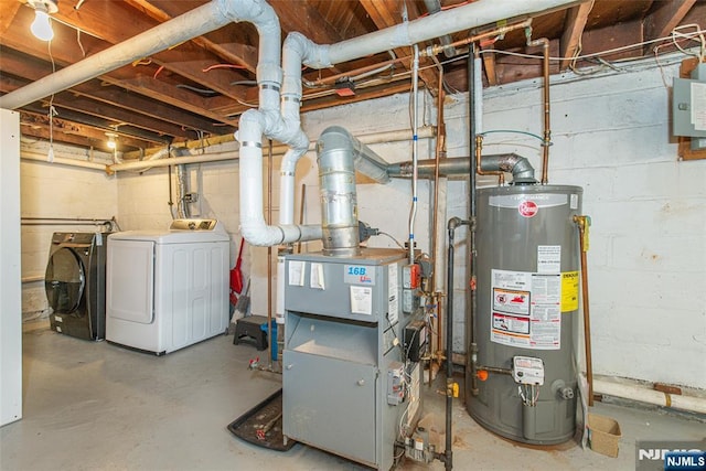 utility room featuring a heating unit, water heater, and washer and clothes dryer