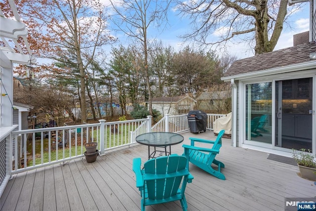 wooden terrace with area for grilling