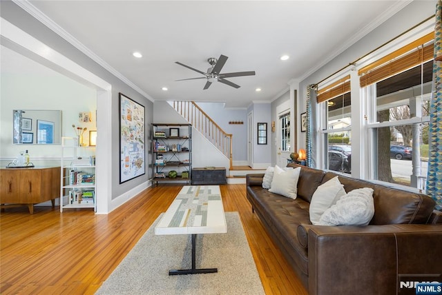 living room featuring ornamental molding, wood finished floors, recessed lighting, baseboards, and stairs