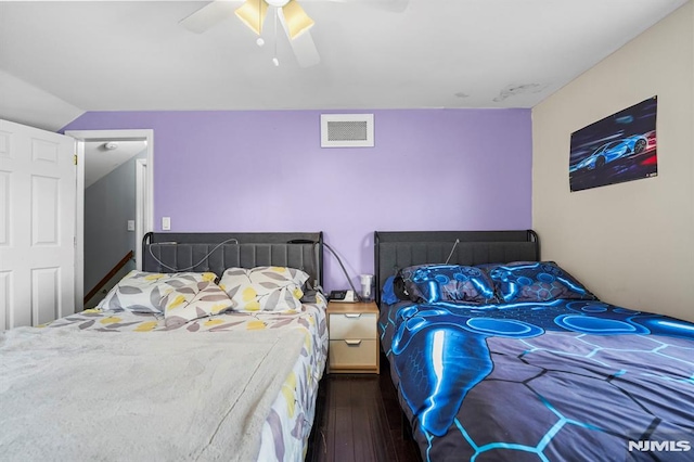 bedroom featuring visible vents, wood-type flooring, and a ceiling fan