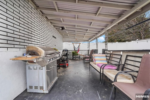 view of patio with a fenced backyard and area for grilling