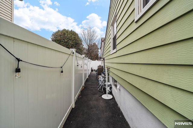 view of side of home with fence