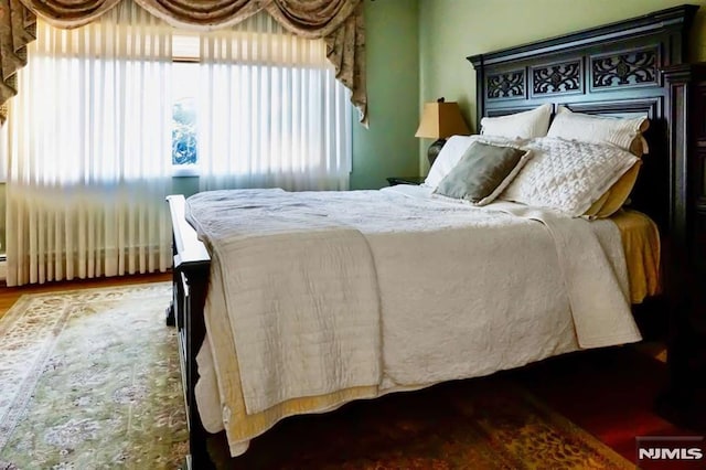 bedroom featuring wood finished floors