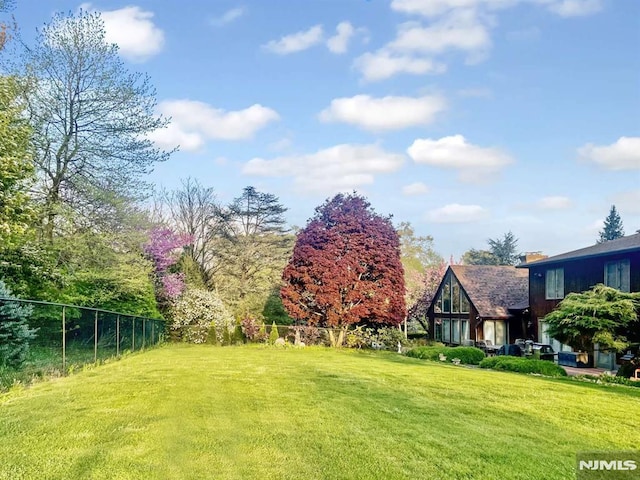 view of yard with fence