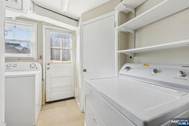 laundry room featuring laundry area and washing machine and clothes dryer