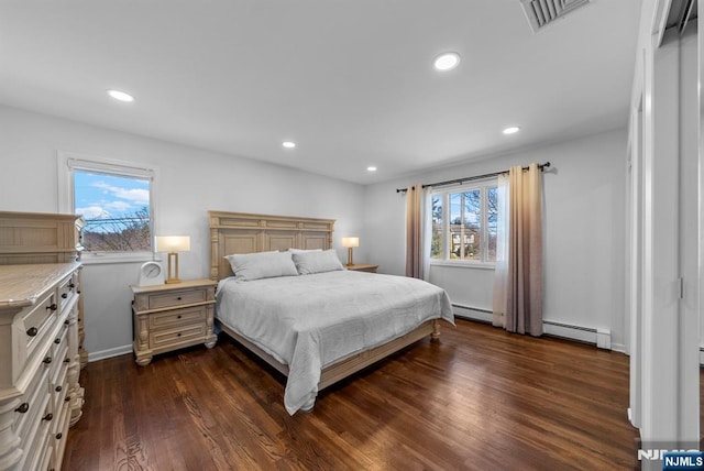 bedroom featuring dark wood-style floors, recessed lighting, visible vents, and a baseboard radiator