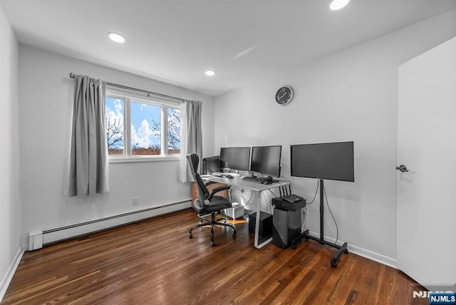 office featuring a baseboard heating unit, baseboards, wood finished floors, and recessed lighting