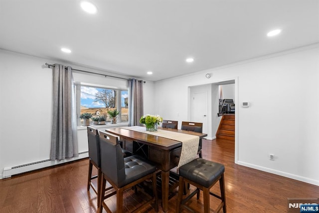 dining space featuring dark wood-style flooring, a baseboard radiator, and recessed lighting