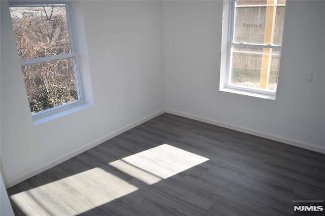 198 Wallace St, Orange, NJ 07050 - unfurnished room with plenty of natural light, wood finished floors, and baseboards