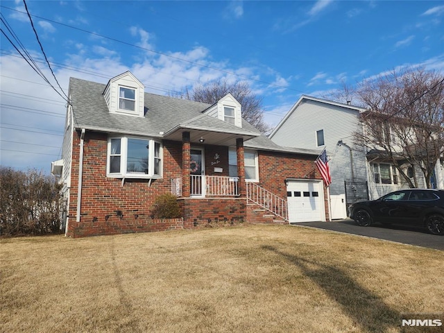 cape cod house featuring driveway, brick siding, a front lawn, and roof with shingles