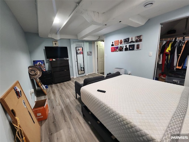 bedroom with light wood-style flooring