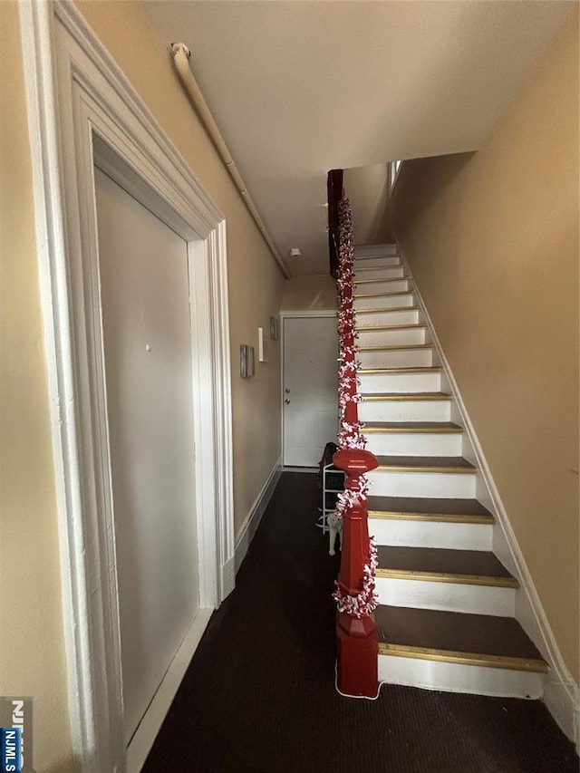 staircase with baseboards