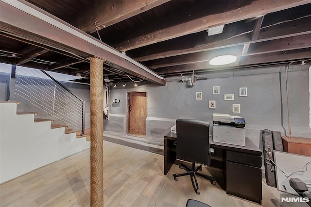 office with light wood-type flooring