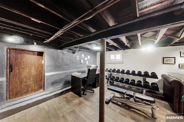 workout room featuring wood finished floors