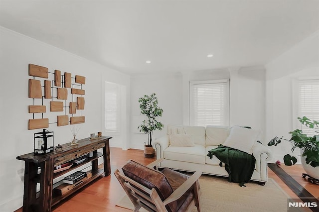 living area with recessed lighting and wood finished floors