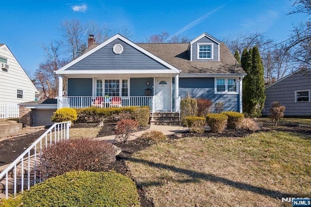 view of front of home with a porch, a shingled roof, and a garage