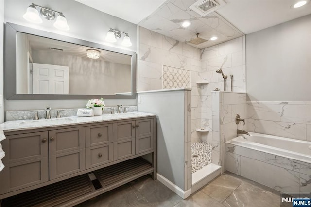 full bath featuring visible vents, double vanity, a sink, a walk in shower, and a bath