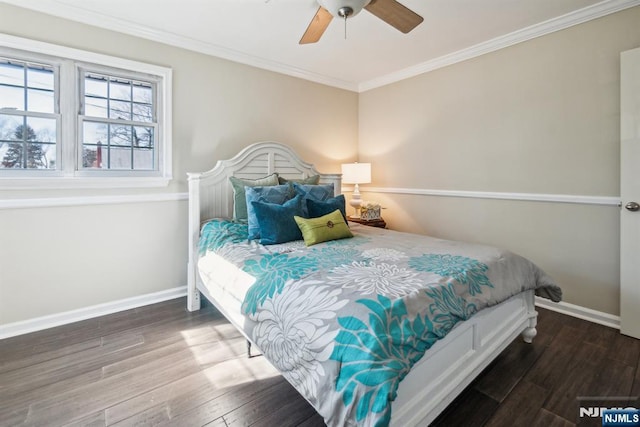 bedroom with ceiling fan, wood finished floors, baseboards, and ornamental molding