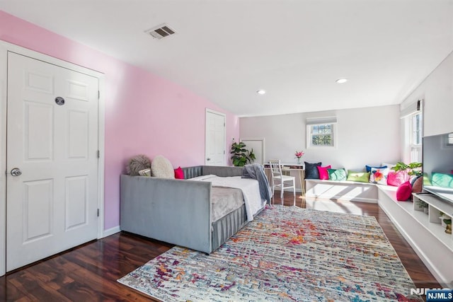 bedroom with recessed lighting, wood finished floors, visible vents, and baseboards