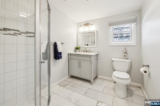 bathroom with toilet, marble finish floor, a shower stall, baseboards, and vanity