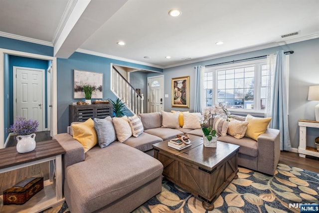 living area featuring visible vents, ornamental molding, wood finished floors, recessed lighting, and stairs