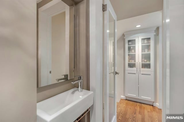 bathroom featuring a sink and wood finished floors