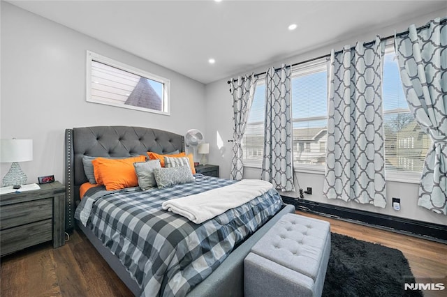 bedroom with dark wood-type flooring and recessed lighting