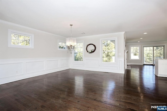 unfurnished dining area with a chandelier, dark wood-style flooring, and a wealth of natural light