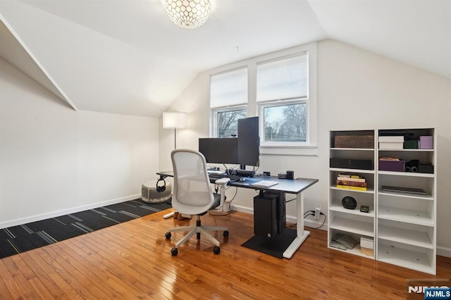 office with lofted ceiling, baseboards, and hardwood / wood-style floors