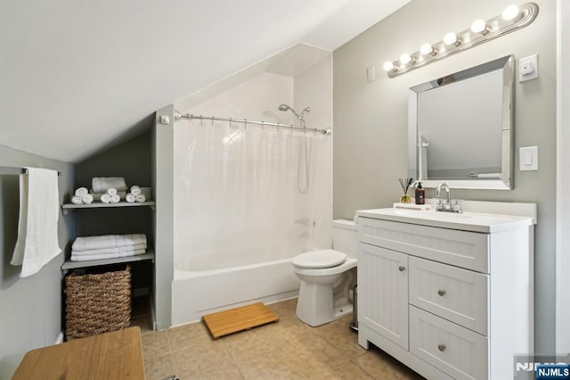 bathroom featuring shower / bath combination with curtain, toilet, vaulted ceiling, vanity, and tile patterned flooring