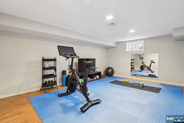 workout room featuring visible vents, baseboards, wood finished floors, and recessed lighting