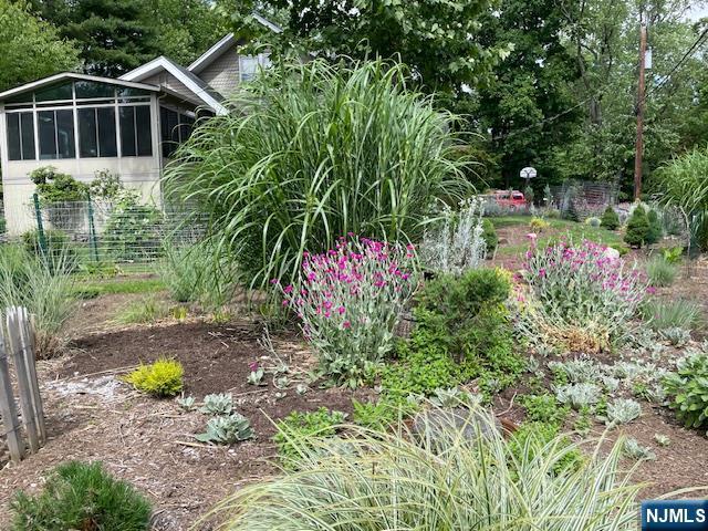 view of yard featuring a sunroom