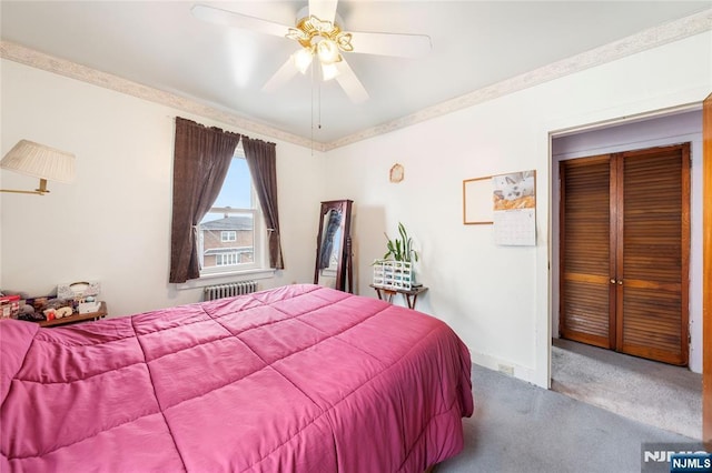 bedroom featuring baseboards, a ceiling fan, radiator, carpet flooring, and a closet