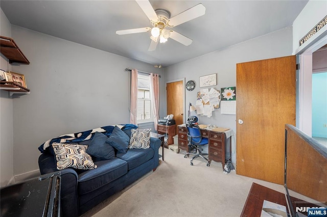 carpeted office with ceiling fan