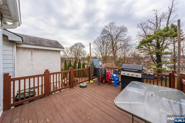 wooden deck with area for grilling