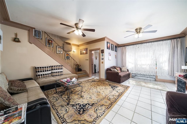 living room with stairs, light tile patterned flooring, a ceiling fan, and ornamental molding