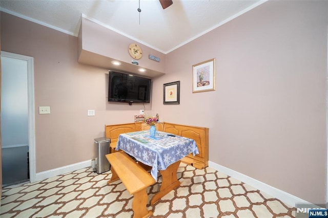 dining space featuring baseboards, light floors, and ornamental molding