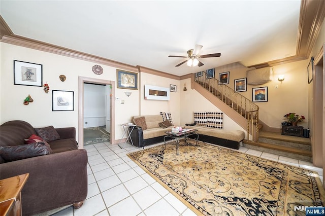 living area with light tile patterned flooring, crown molding, stairs, and a ceiling fan