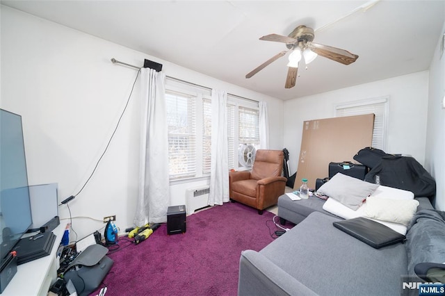 carpeted bedroom featuring radiator heating unit and ceiling fan