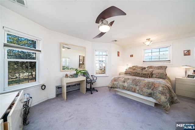 bedroom with visible vents, baseboards, carpet, and ceiling fan