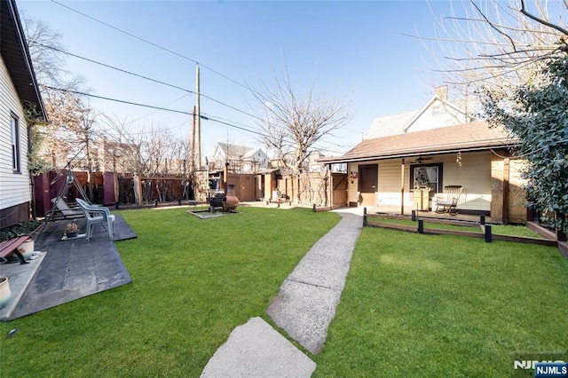 view of yard with a patio and a fenced backyard