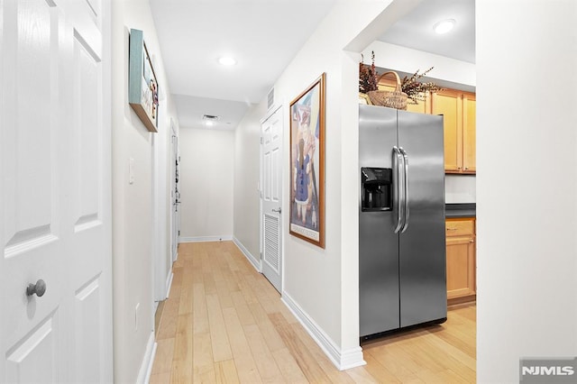 hallway featuring visible vents, recessed lighting, baseboards, and light wood-style floors